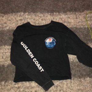 Black long sleeve crop top with decal